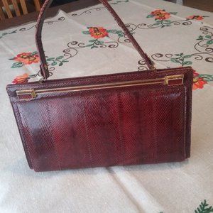 Vintage burgundy colored snake skin handbag.